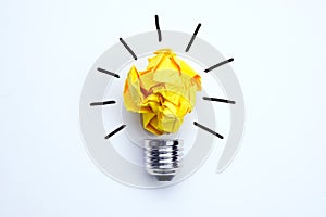 Great idea concept with crumpled yellow paper light bulb