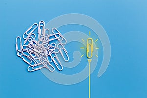 Great ideas concept with paperclip, thinking   ,creativity, light bulb on blue background, new ideas concept