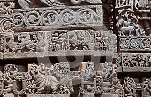 Great Indian architecture, with fantasy animals, birds, ancient people and patterns inside 12th century temple, India.