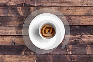 Great italian espresso coffee in a white cup with et @ email symbol shape, technology concept