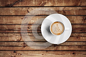 Great italian espresso coffee in a white cup on wood table with foam tree christmas shape