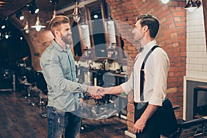 Great job! Happy satisfied client in a barber shop. Red bearded