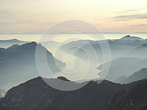 Great landscape at Iseo lake in winter season, foggy and humidity in the air. Panorama from Monte Pora, Alps, Italy