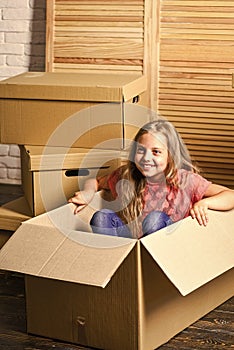 Great Life. happy little girl with bear toy. Cardboard boxes - moving to new house. happy child cardboard box. repair of