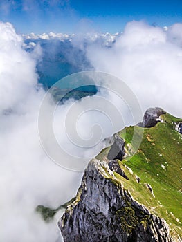 Great Majestic Dreamy Landscape View of Natural Swiss Alps from Mount Pilatus Peak. Breathtaking view of Steep Cliff and fog