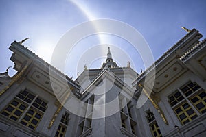 A great marble church with sun halo and blue sky, Wat Sothorn, Chachoengsao Thailand