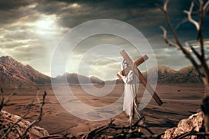 Great martyr with cross in desert, sun rays