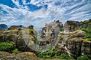 Great Meteoron monastery in rocky landscape, Meteora valley, Greece, UNESCO World Heritage, mountains, rich foliage