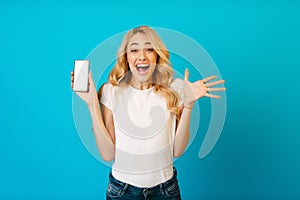 Great offer. Surprised girl showing phone with blank screen