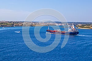 Great petrol tanker sailing the coast of Menorca, Spain