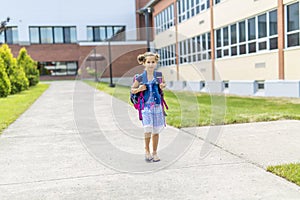 Great Portrait Of School Pupil Outside Classroom Carrying Bags