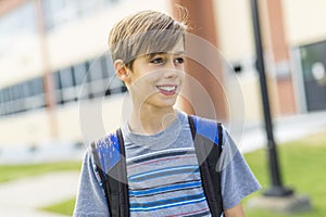 Great Portrait Of School Pupil Outside Classroom Carrying Bags