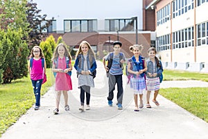 Great Portrait Of School Pupil Outside Classroom Carrying Bags