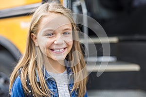 Great Portrait Of School Pupil Outside Classroom Carrying Bags