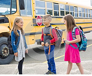 Great Portrait Of School Pupil Outside Classroom Carrying Bags