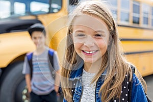 Great Portrait Of School Pupil Outside Classroom Carrying Bags