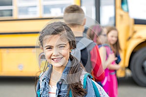 Great Portrait Of School Pupil Outside Classroom Carrying Bags