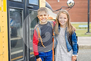 Great Portrait Of School Pupil Outside Classroom Carrying Bags