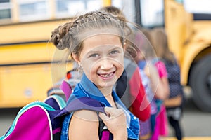 Great Portrait Of School Pupil Outside Classroom Carrying Bags