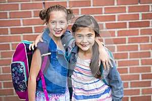 Great Portrait Of School Pupil Outside Classroom Carrying Bags