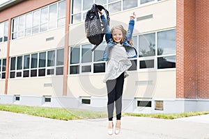 Great Portrait Of School Pupil Outside Classroom Carrying Bags