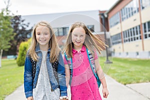 Great Portrait Of School Pupil Outside Classroom Carrying Bags