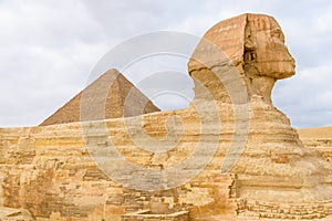 The great pyramid of Cheops and Sphinx in Giza plateau. Cairo, Egypt