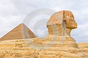 The great pyramid of Cheops and Sphinx in Giza plateau. Cairo, Egypt