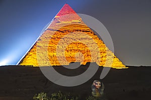 Great Pyramid of Giza illuminated at night, UNESCO World Heritage site, Cairo, Egypt.