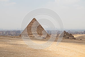 The Great Pyramid of Menkaure in the Giza, Egypt. Pyramid Complex on background Cairo city skyline