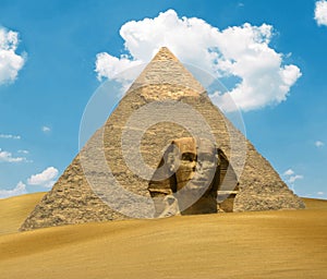 Great Pyramid of Pharaoh Khufu and the Sphinx on sand dunes - Egypt concept