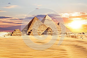 The Great Pyramids of Egypt at sunset, one of the wonders of the World, Giza