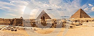 The Great Pyramids of Giza and The Sphinx near the ruins of a temple in Giza, Egypt