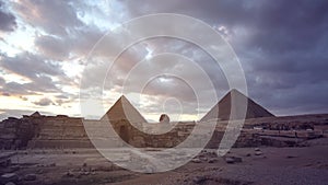 Great pyramids of Giza with sphinx panorama view at evening sunset