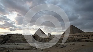 Great pyramids of Giza with sphinx panorama view at evening sunset