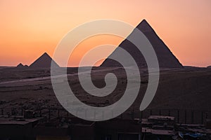 Great Pyramids of Giza on top of Giza plateau in a beautiful evening sunset, Giza, Cairo, Lower Egypt