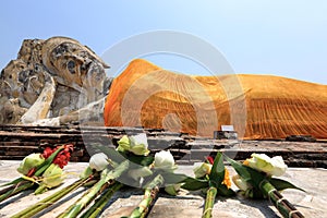 The great reclining Buddha with a bright orange sash is all that remains of Wat Lokaya Sutha. Ayutthaya, Thailand