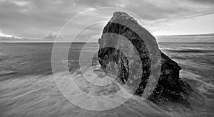 Great rock in the middle of the sea photo