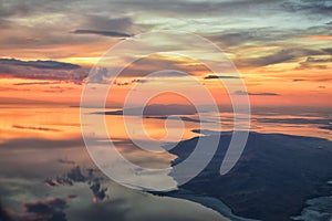 Great Salt Lake Sunset Aerial view from airplane in Wasatch Rocky Mountain Range, sweeping cloudscape and landscape Utah