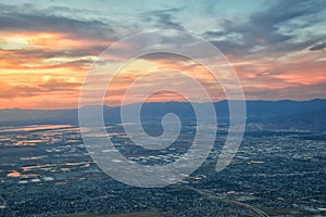 Great Salt Lake Sunset Aerial view from airplane in Wasatch Rocky Mountain Range, sweeping cloudscape and landscape Utah