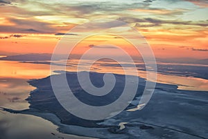 Great Salt Lake Sunset Aerial view from airplane in Wasatch Rocky Mountain Range, sweeping cloudscape and landscape Utah