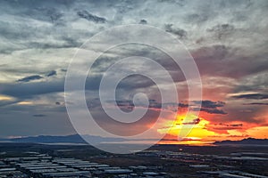 Great Salt Lake Sunset Aerial view from airplane in Wasatch Rocky Mountain Range, sweeping cloudscape and landscape Utah