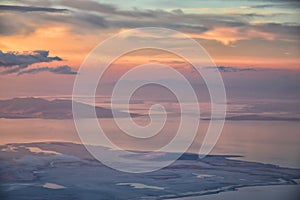 Great Salt Lake Sunset Aerial view from airplane in Wasatch Rocky Mountain Range, sweeping cloudscape and landscape Utah