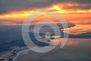 Great Salt Lake Sunset Aerial view from airplane in Wasatch Rocky Mountain Range, sweeping cloudscape and landscape Utah