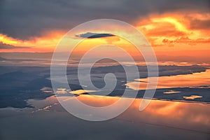 Great Salt Lake Sunset Aerial view from airplane in Wasatch Rocky Mountain Range, sweeping cloudscape and landscape Utah