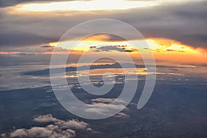 Great Salt Lake Sunset Aerial view from airplane in Wasatch Rocky Mountain Range, sweeping cloudscape and landscape Utah