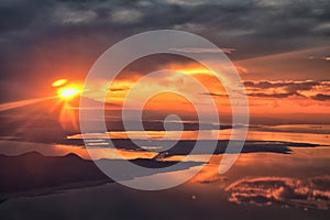 Great Salt Lake Sunset Aerial view from airplane in Wasatch Rocky Mountain Range, sweeping cloudscape and landscape Utah