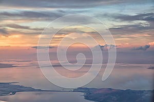 Great Salt Lake Sunset Aerial view from airplane in Wasatch Rocky Mountain Range, sweeping cloudscape and landscape Utah