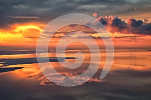 Great Salt Lake Sunset Aerial view from airplane in Wasatch Rocky Mountain Range, sweeping cloudscape and landscape Utah