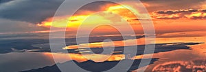 Great Salt Lake Sunset Aerial view from airplane in Wasatch Rocky Mountain Range, sweeping cloudscape and landscape Utah